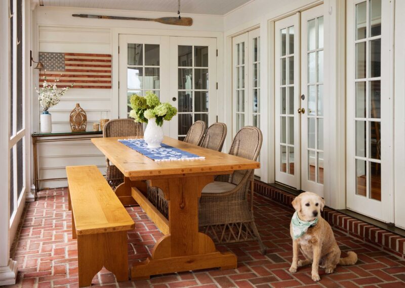 Sunroom table with dog nearby