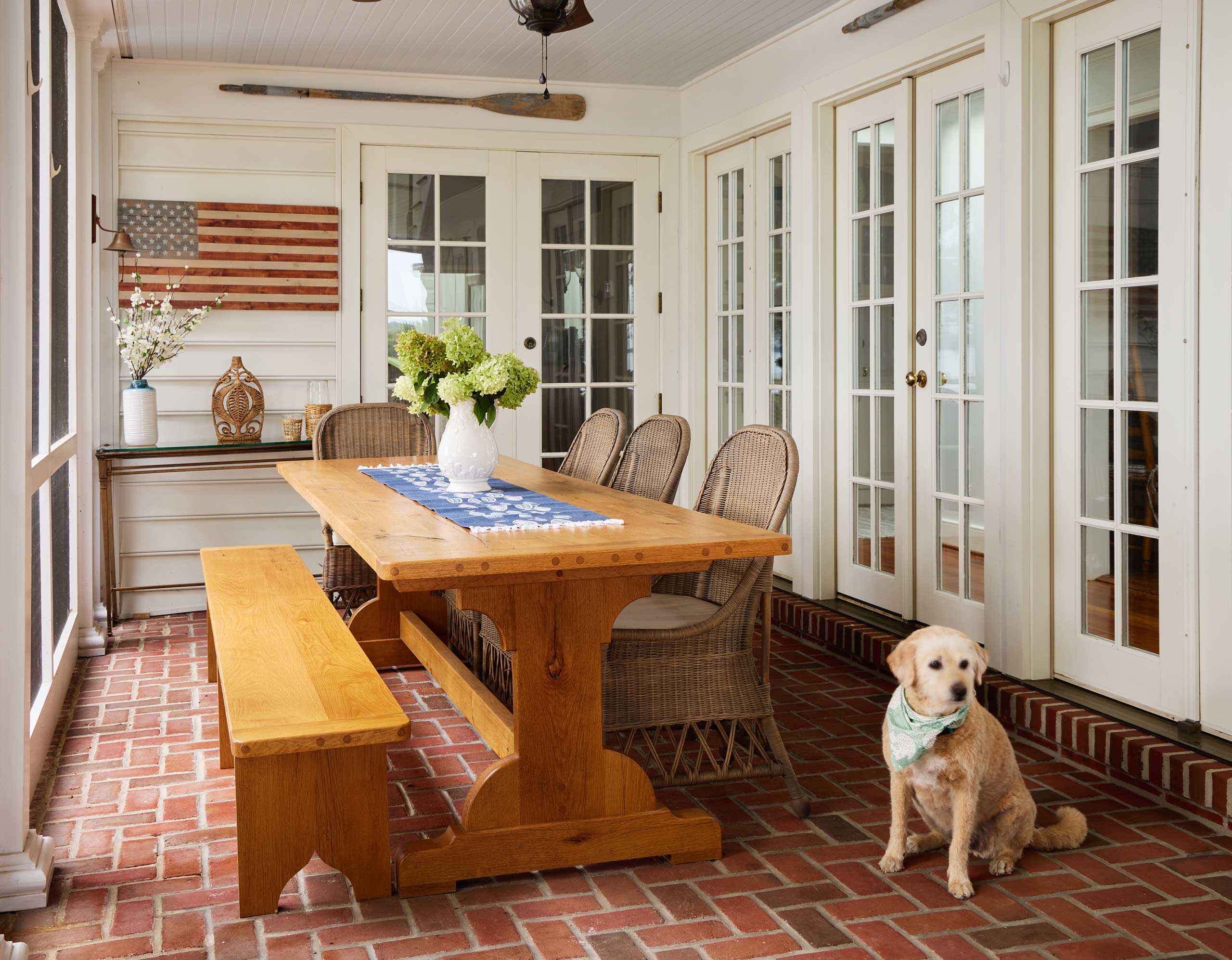 Sunroom table with dog nearby